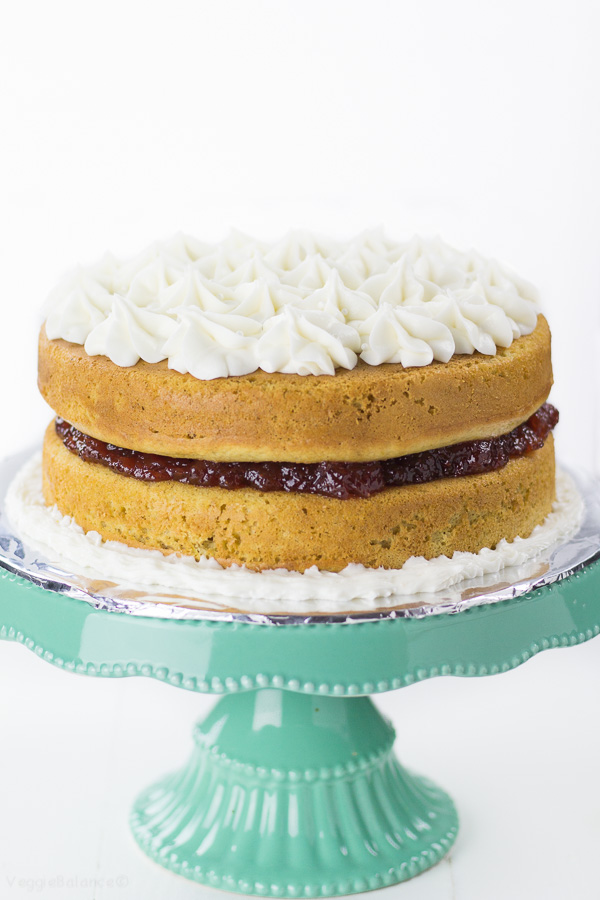 Gluten-Free Lemon Jelly Cake recipe made a little bit healthier with a low-sugar moist lemon cake and a Naked Cake frosting style helping to cut down on that extra frosting but still with all the delicious lemon and strawberry flavor. (Gluten-Free, Dairy-Free, Vegan Friendly)