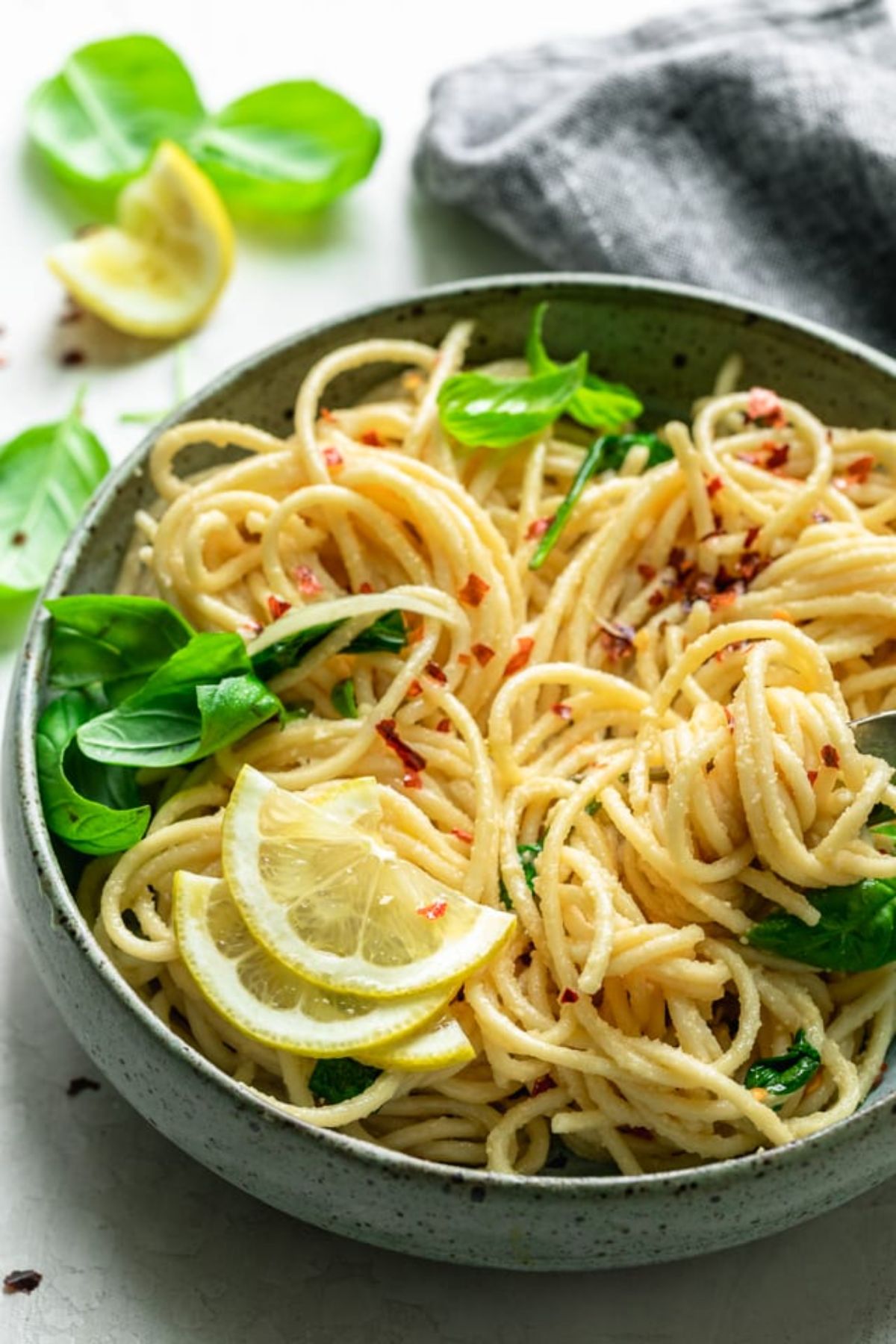 Mediterranean hummus linguine topped with chilli flakes and fresh basil