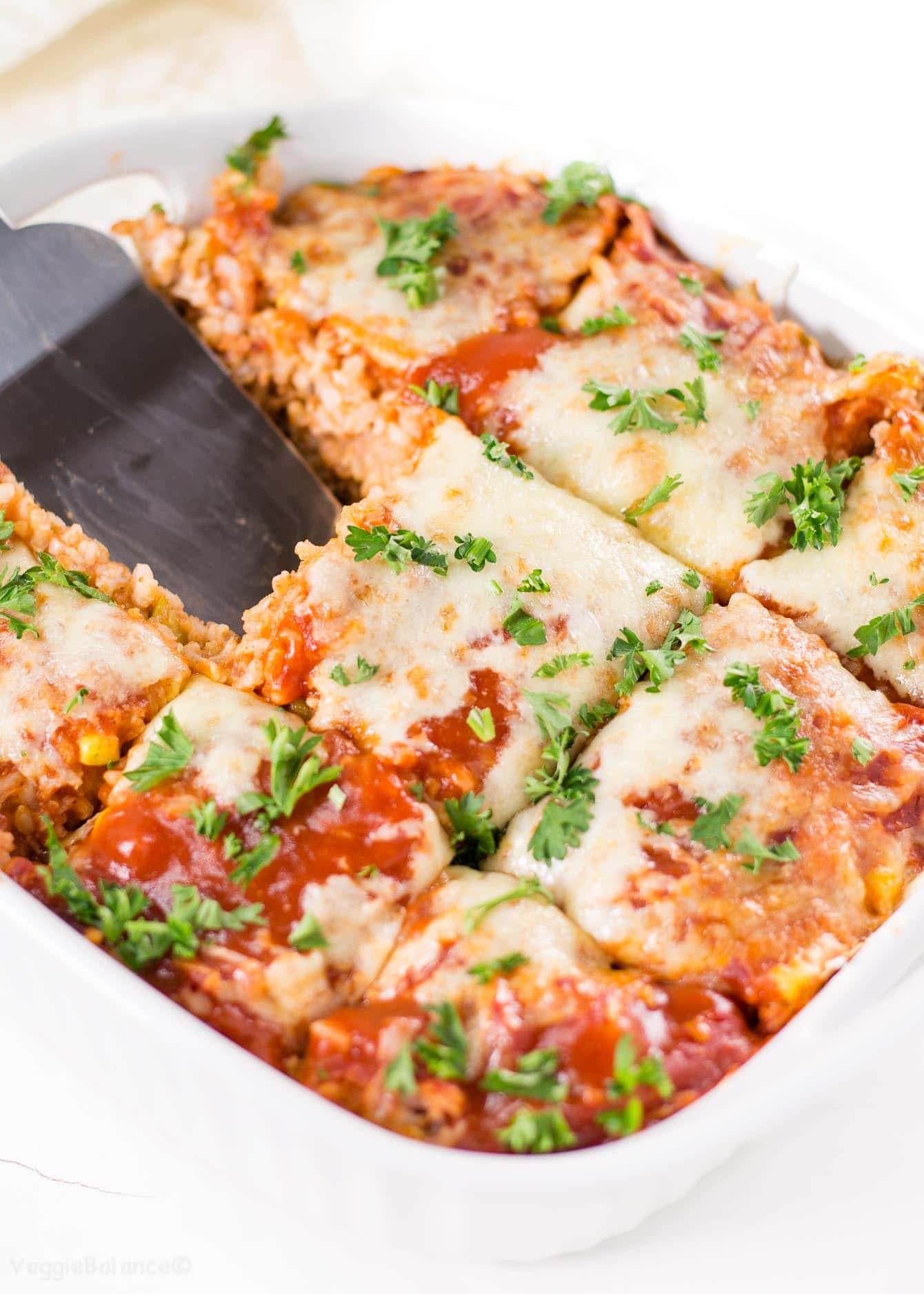 Enchilada Rice Casserole in white casserole dish