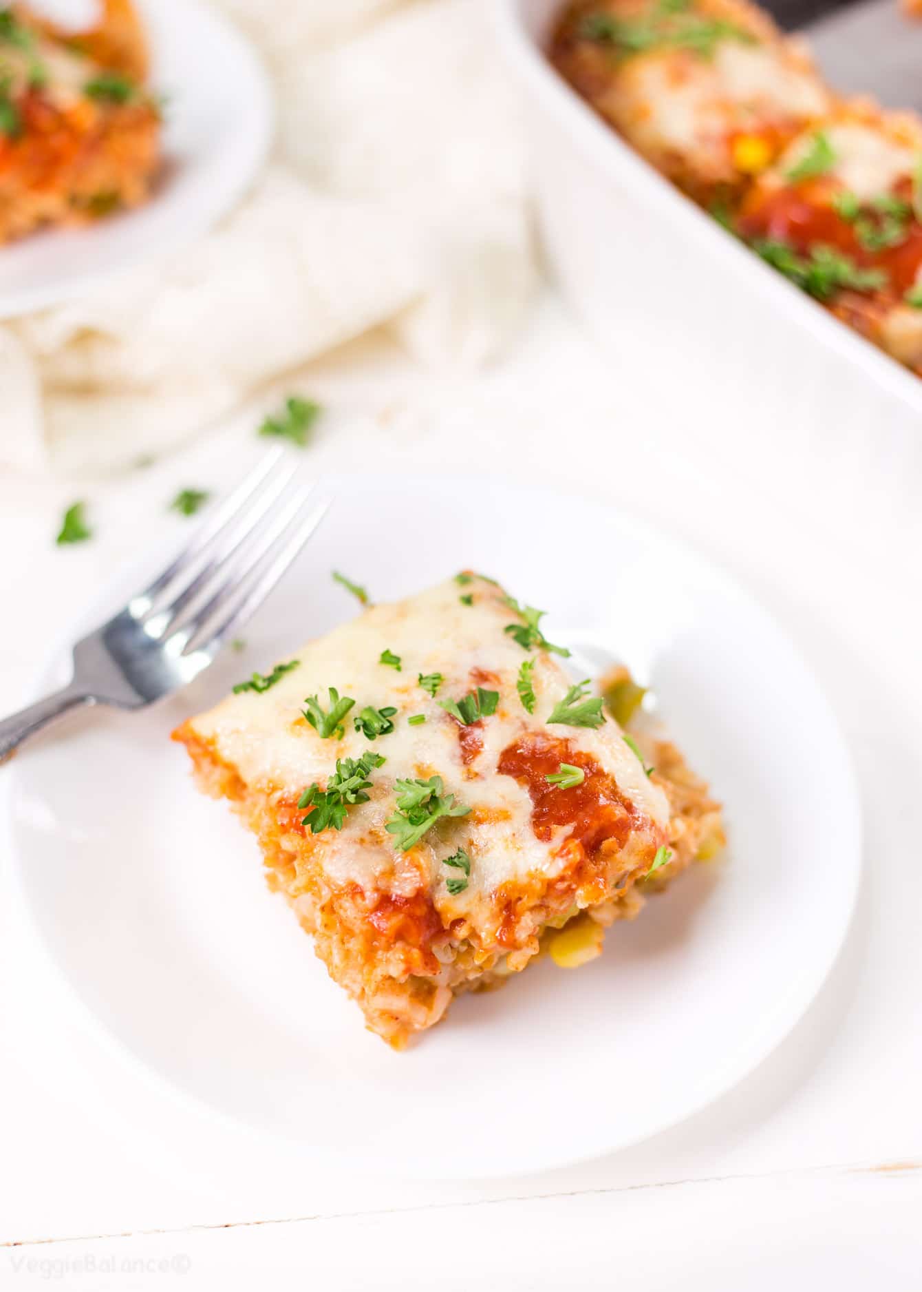 Enchilada Rice Casserole in white casserole dish