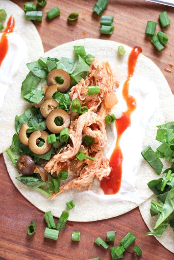 Crockpot Shredded Chicken Tacos on Cutting Board