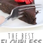 PINTEREST IMAGE with words "The Best Flourless Chocolate Cake" The Best Flourless Chocolate Cake slice with a strawberry on top