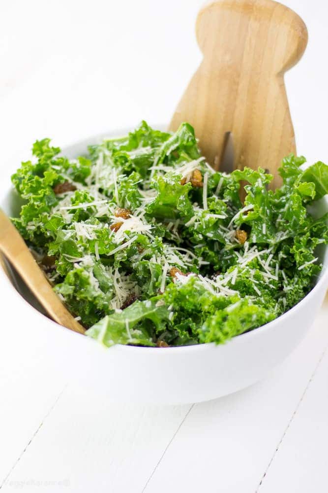 Kale Lemon Salad with salty Parmesan and sweet golden raisins. This healthy kale salad is swimming in a perfect olive oil and lemon dressing. It is sure to win over any kale hater’s heart. (Gluten Free)