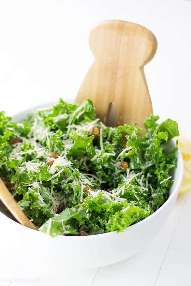Kale Lemon Salad with salty parmesan and sweet golden raisins. This healthy kale salad is swimming in a perfect olive oil and lemon dressing.