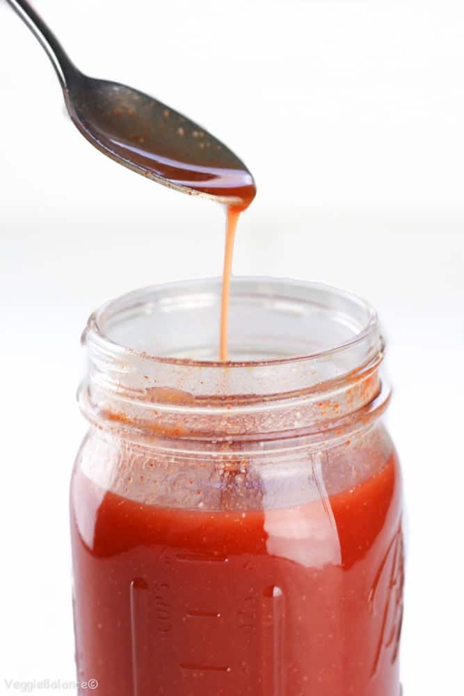 Homemade Buffalo Sauce in Mason Jar with Spoon Drip