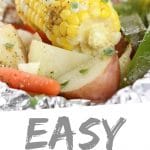 PINTEREST IMAGE with words "Easy Hobo Dinner" Easy Hobo Dinner with corn cob, carrots, potatoes, and peppers.