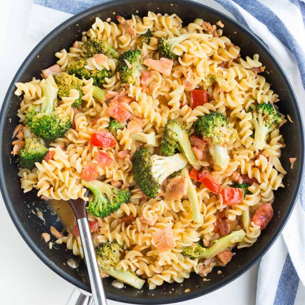 Salmon Cajun Pasta in a skillet with broccoli