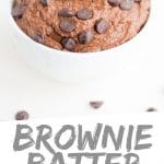 PINTEREST IMAGE with words "Brownie Batter Chocolate Hummus" Brownie Batter Chocolate Hummus in small white bowl with chocolate chips and a cookie on top.