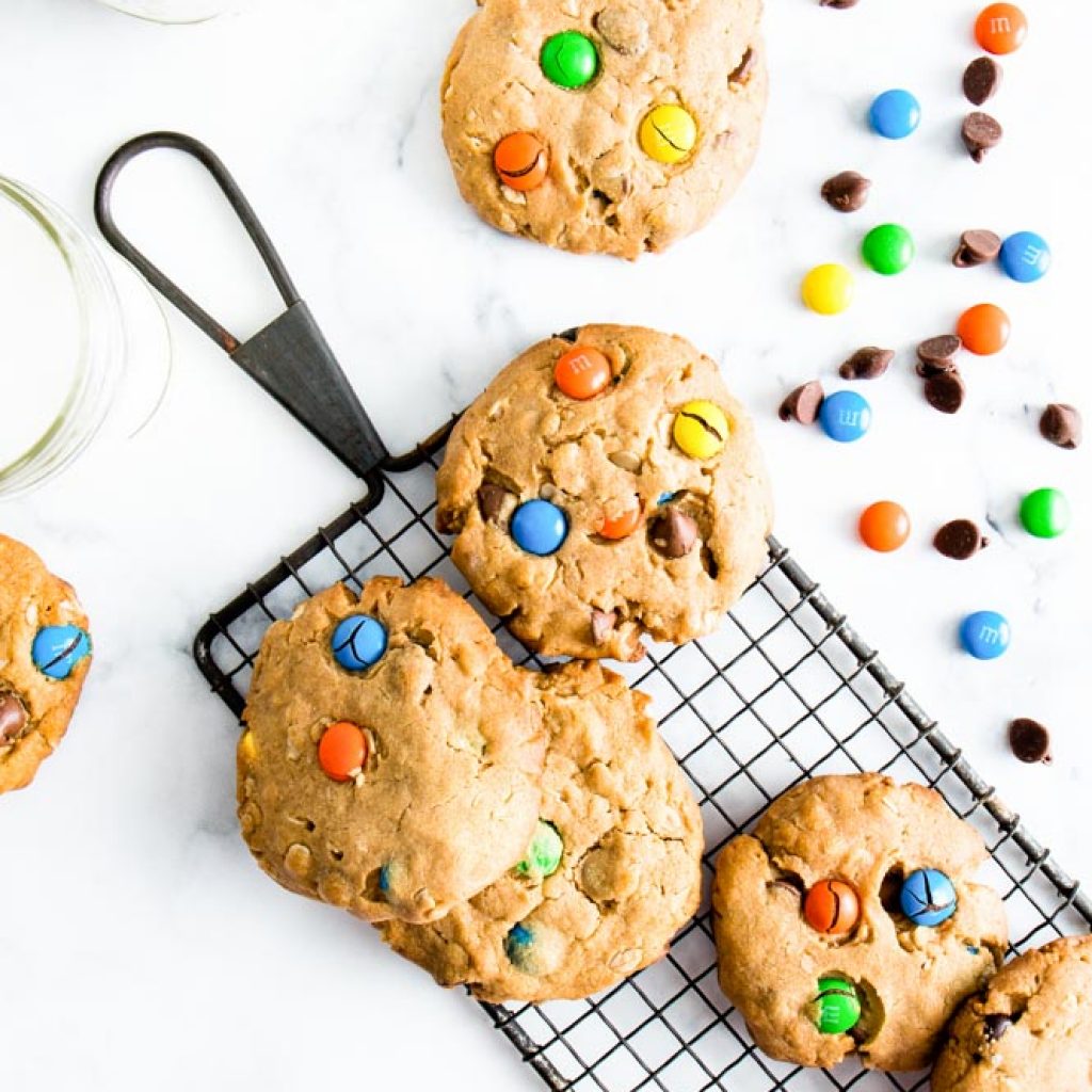 Overhead shot of Gluten Free Monster Cookies with M&M's on a cooling rack