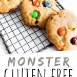 PINTEREST IMAGE with words "Monster Gluten Free Cookies" Gluten Free Monster Cookies with M&M's on a cooling rack