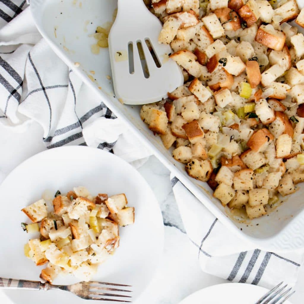 Overhead shot of Gluten Free Stuffing on a plate and in a white casserole dish