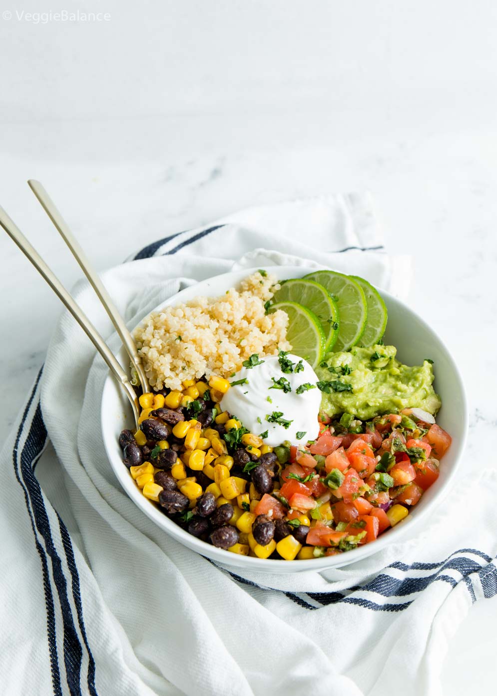 Easy Vegan Burrito Bowl with sour cream, cilantro lime quinoa