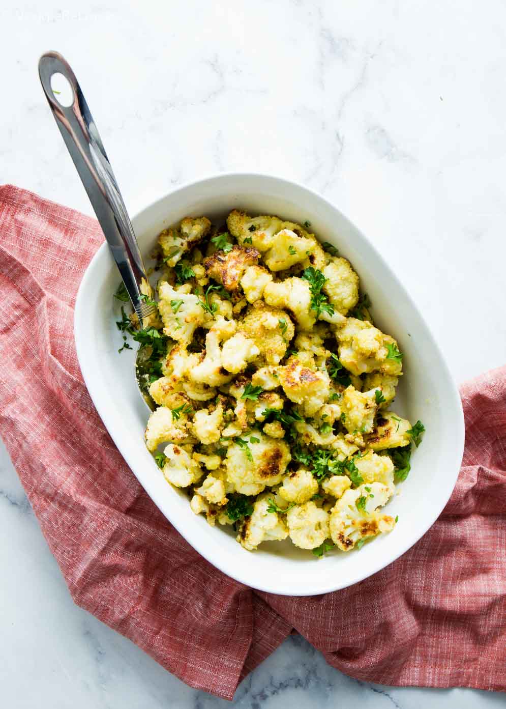 Cheesy Vegan Roasted Cauliflower in a casserole dish