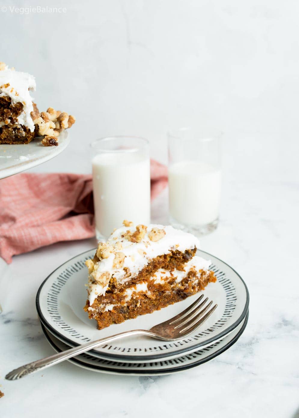 Slice of Vegan Carrot Cake on a white plate