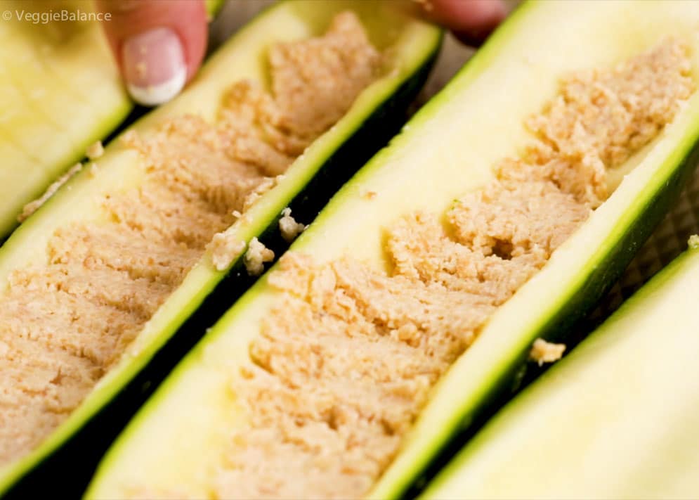 Vegan Ricotta Cheese being used in a stuffed zucchini boat recipe