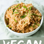 PINTEREST IMAGE with words "Vegan Refried Beans" Image vegetarian refried beans on light green napkin and white table