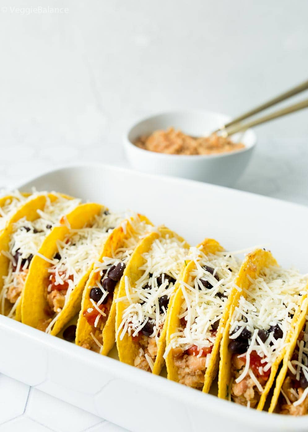 Oven baked vegetarian refried bean tacos about to go into the oven 