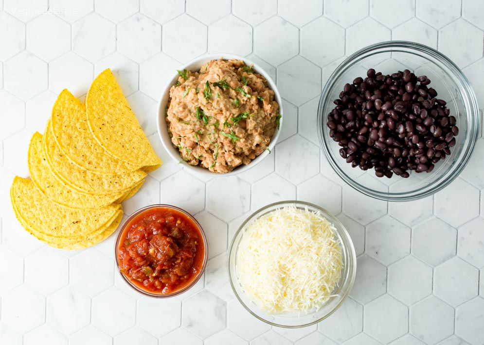 Overhead shot of ingredients needed to make baked refried bean tacos