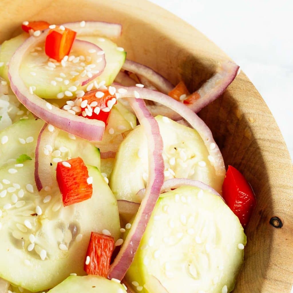 Wooden bowl filled with asian cucumber salad