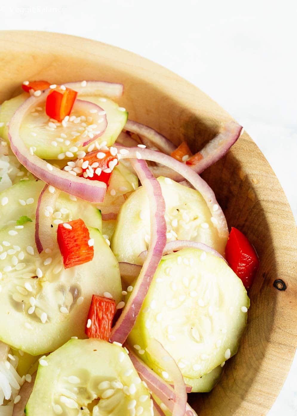 Wooden bowl filled with asian cucumber salad