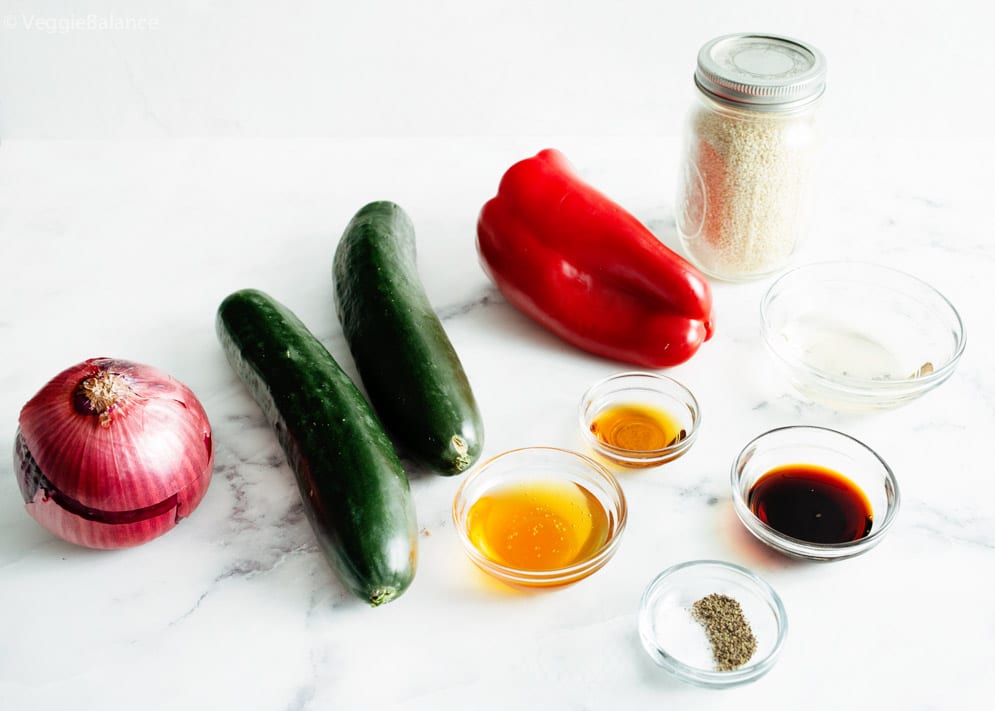 Ingredients needing for Asian Cucumber Salad laid out onto white countertop