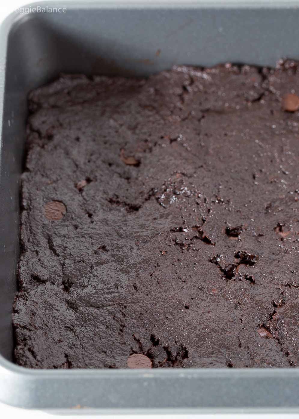 Vegan Brownie mixture pressed into the pan before baking