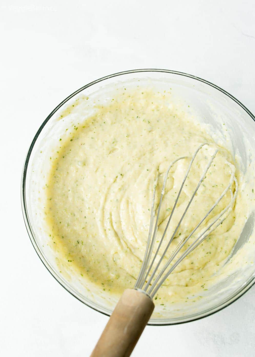zucchini bread mixture with whisk
