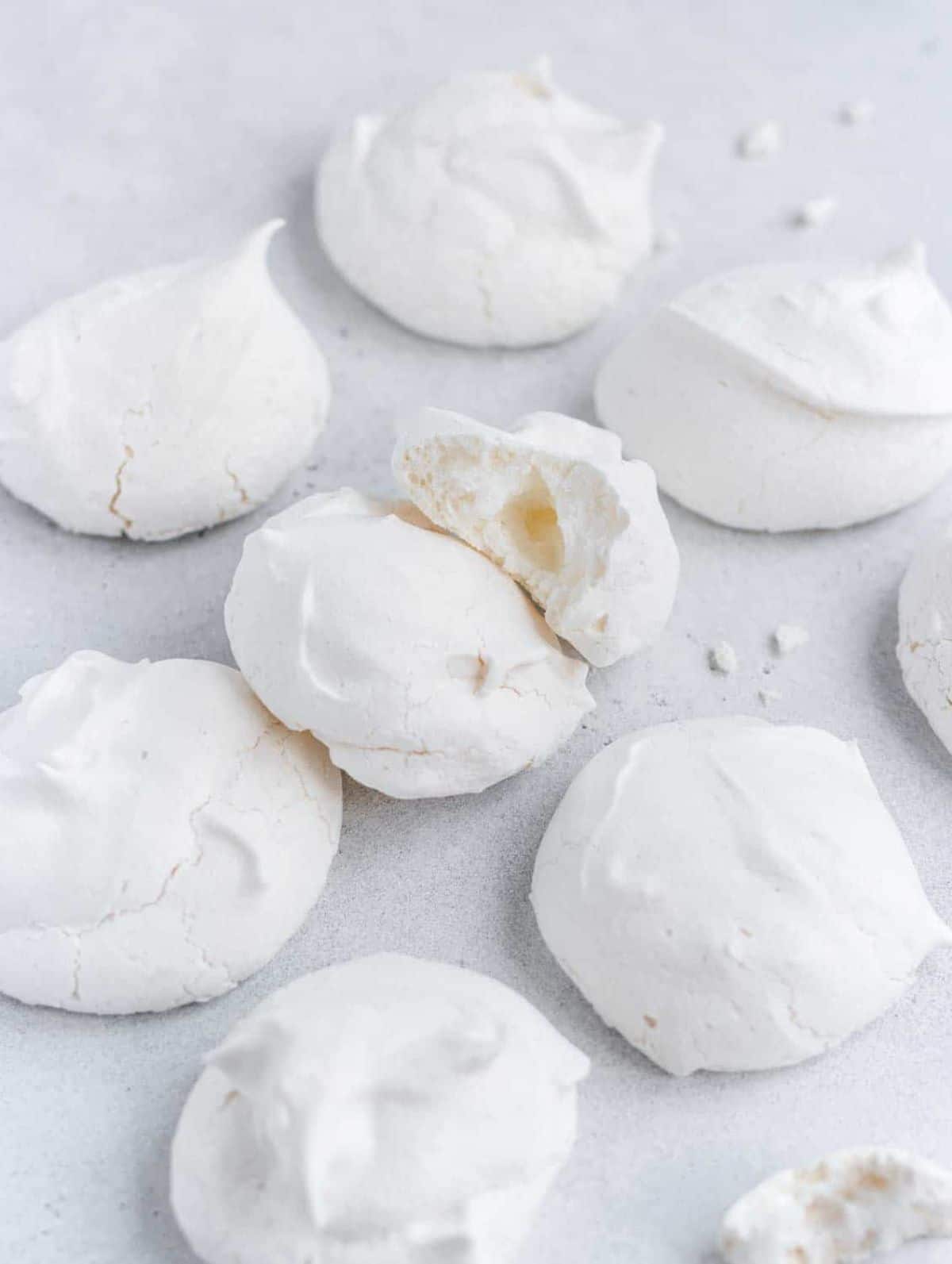 a pile of vegan meringues on a white surface
