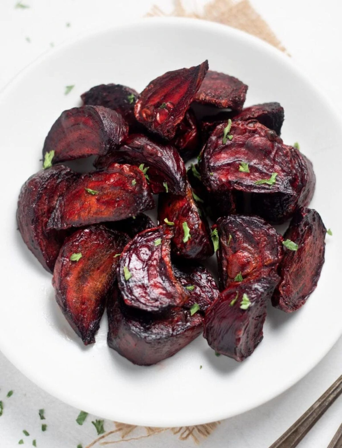 a white plate filled with roasted beets