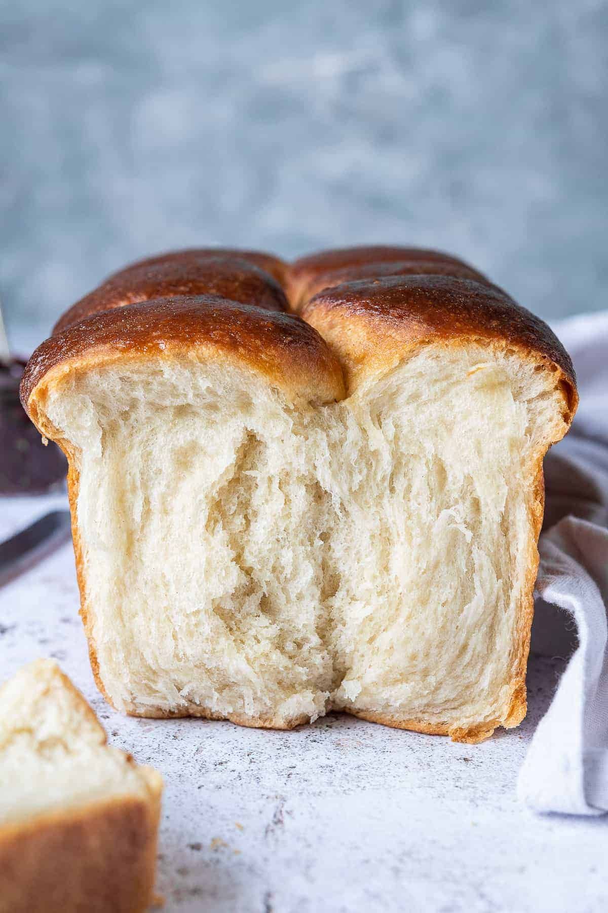 a cut open vegan brioche facing the camera