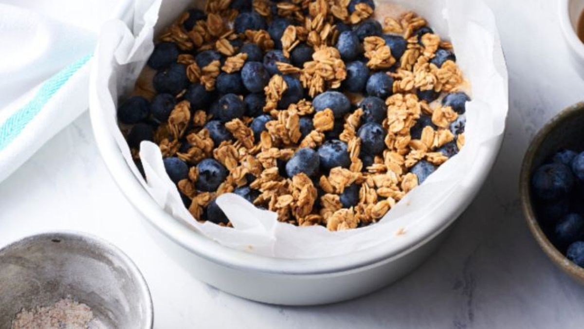 a bowl of granola with blueberries