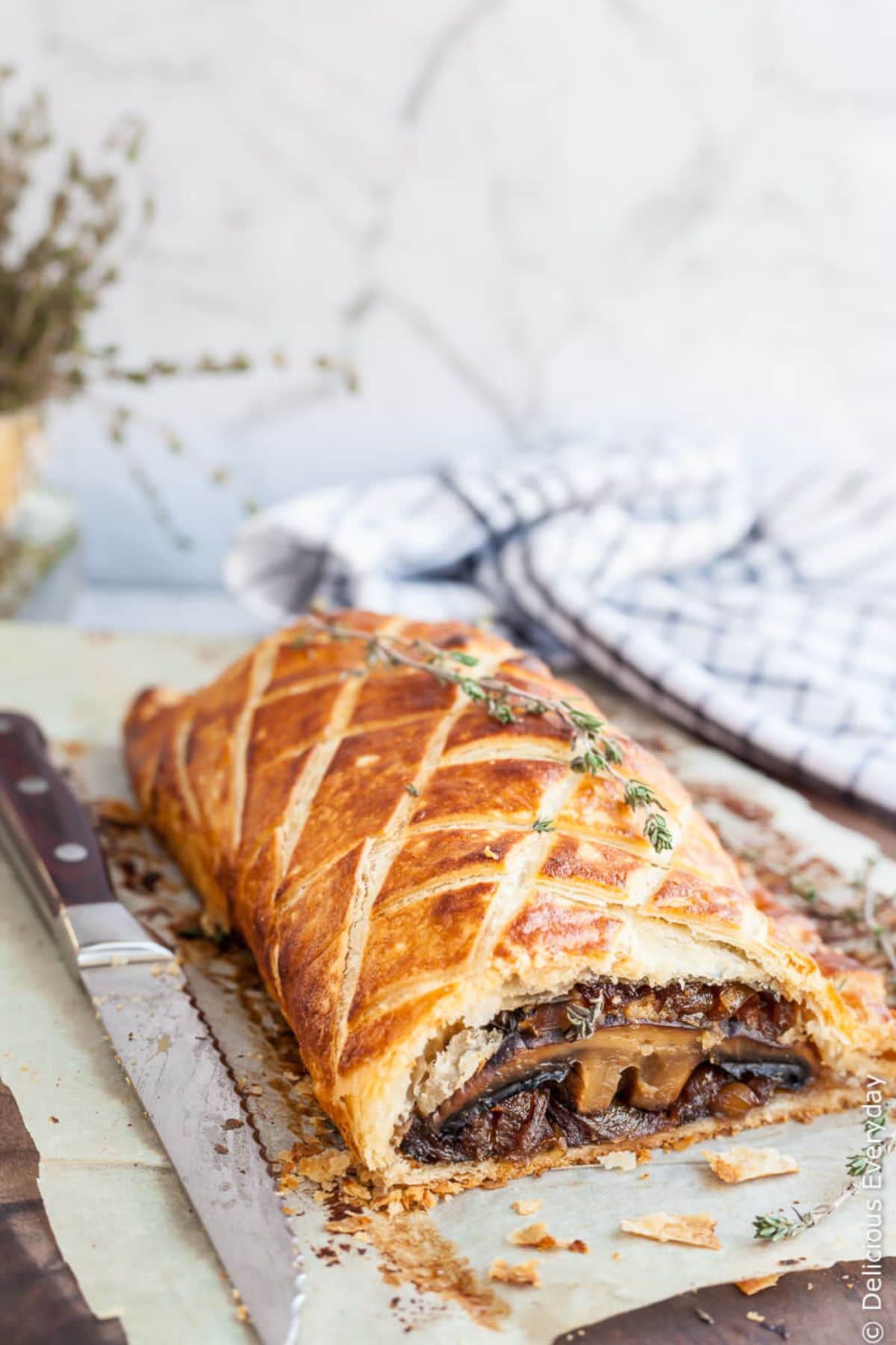 a sliced open vegan mushroom wellington