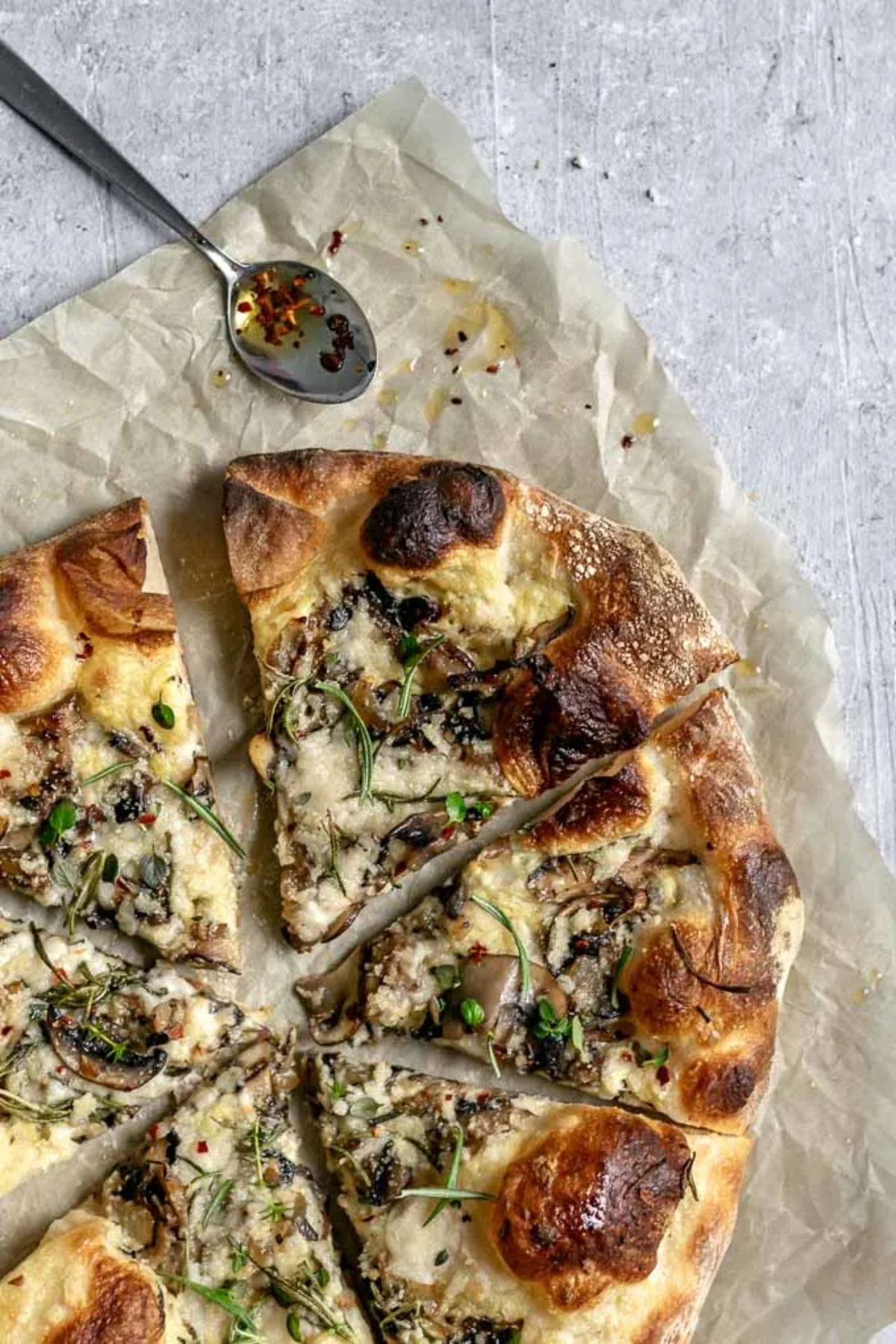 a sliced up vegan caramalized mushroom pizza